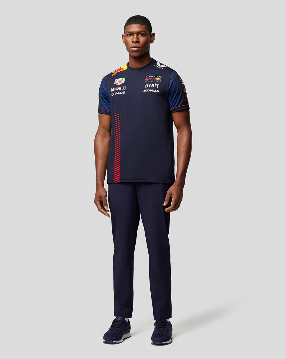 Full-body view of a male model wearing the Oracle Red Bull Racing Set Up T-Shirt Night Sky with sponsor logos and a red side stripe.