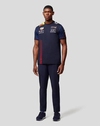 Full-body view of a male model wearing the Oracle Red Bull Racing Set Up T-Shirt Night Sky with sponsor logos and a red side stripe.