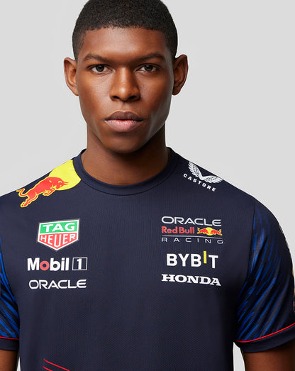 Close-up of a male model in the Oracle Red Bull Racing Set Up T-Shirt Night Sky, highlighting front sponsor logos.