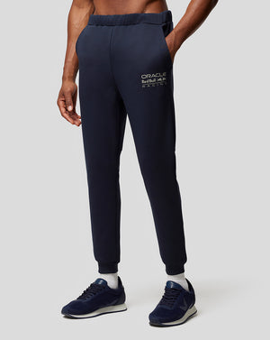Navy Night Sky Oracle Red Bull Racing joggers with a logo on the thigh worn with sneakers.