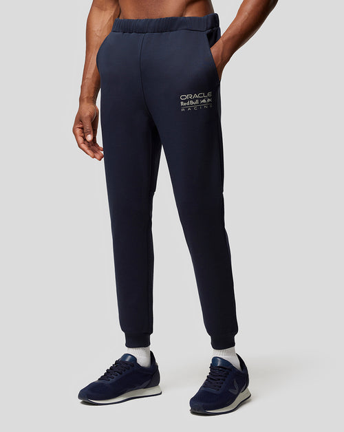 Navy Night Sky Oracle Red Bull Racing joggers with a logo on the thigh worn with sneakers.