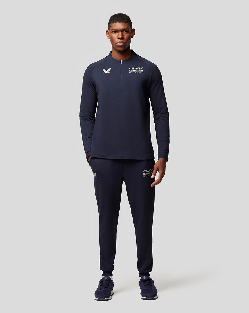 Male model in navy night sky Oracle Red Bull Racing lifestyle outfit with logos on chest and leg