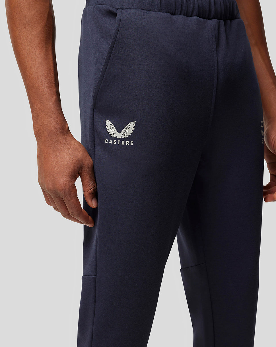 Navy lifestyle pant with white Castore wing logo on the left thigh