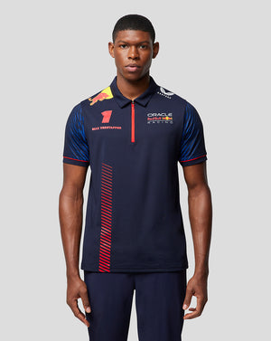 Front view of a male model wearing a navy Oracle Red Bull Racing polo with Verstappen branding and sponsor logos.