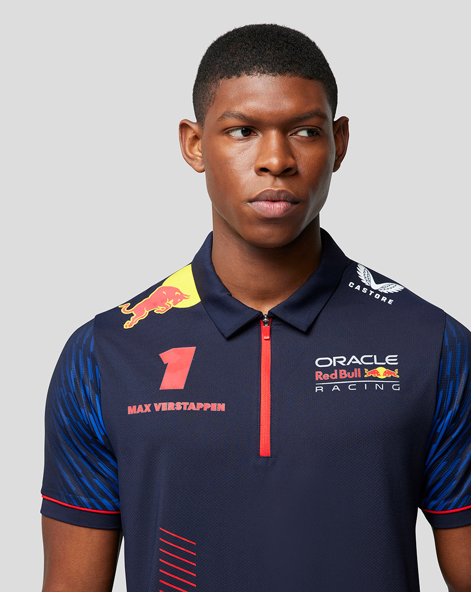 Frontal view of the navy Max Verstappen polo with Verstappen name on the left chest and sponsor logos on the right.