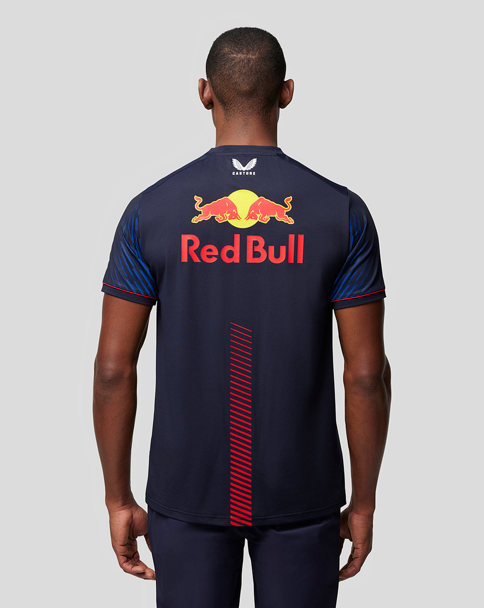 Back view of a man wearing a navy Oracle Red Bull Racing T shirt with a large Red Bull logo across the back