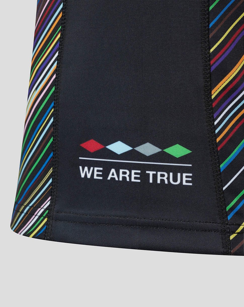 Lower front of Pride shirt featuring We Are True slogan and multicolor diamonds on dark fabric