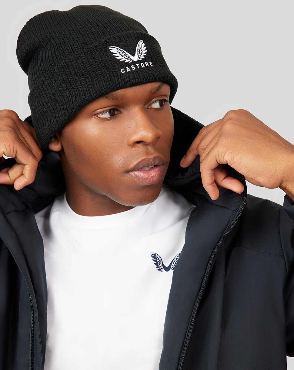 Black knit Active Beanie worn by a model with CASTORE logo on the front.