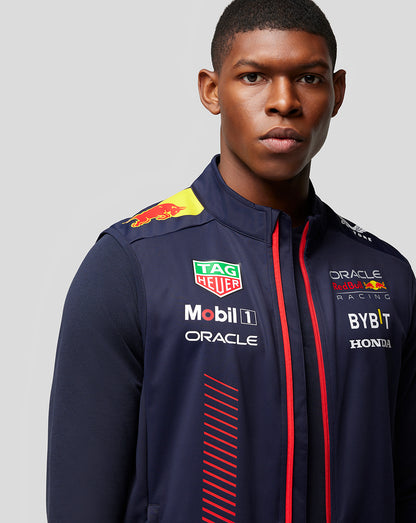 Front view of a male model wearing navy Oracle Red Bull Racing Replica Hybrid Gilet Night Sky with sponsor logos across the chest.