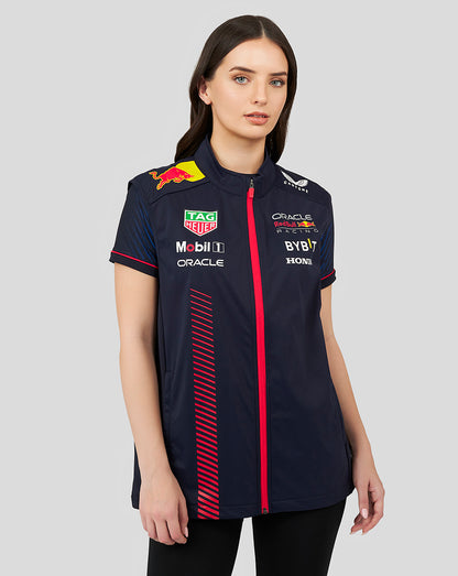 Female model wearing navy Oracle Red Bull Racing replica hybrid gilet with sponsor logos