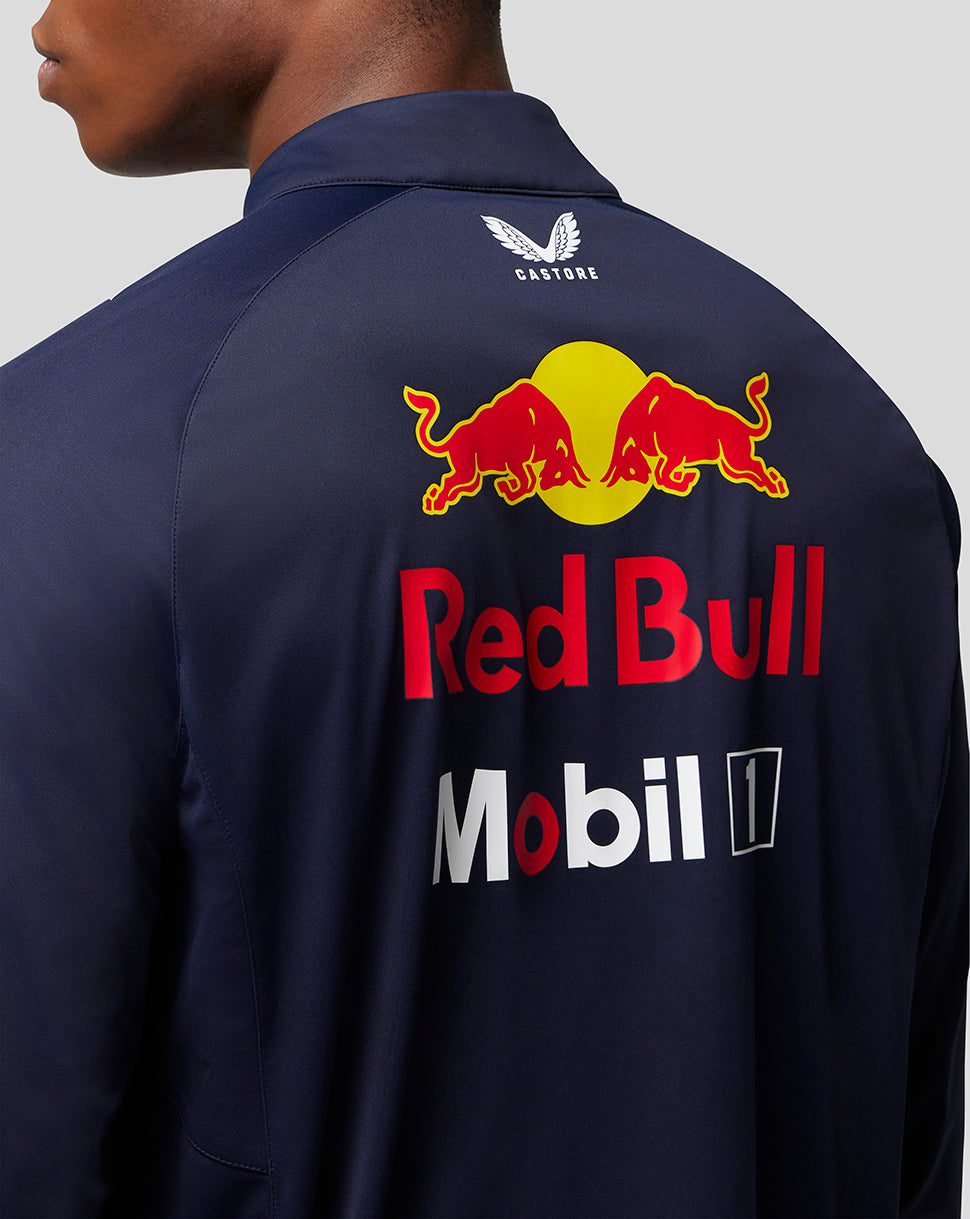 Back view of navy Red Bull Racing soft shell jacket with a large Red Bull logo and sponsor branding