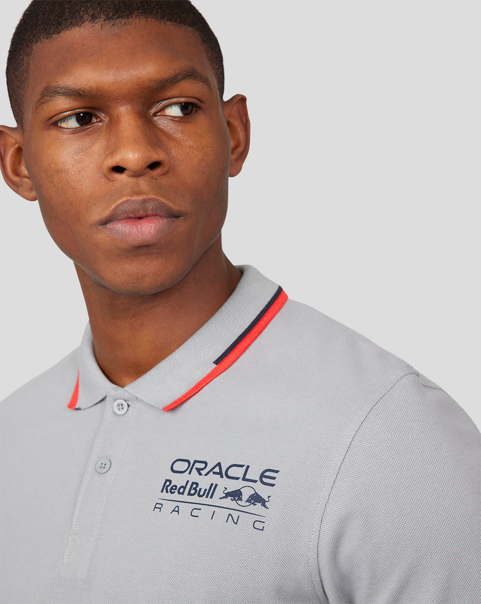 Close-up of a man wearing the grey Oracle Red Bull Racing Core Polo with the team logo on the chest.