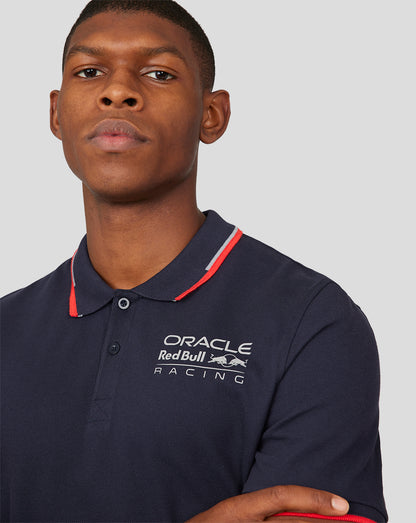 Close up of navy Night Sky Oracle Red Bull Racing Core Polo showing logo on the chest and red tipped collar.