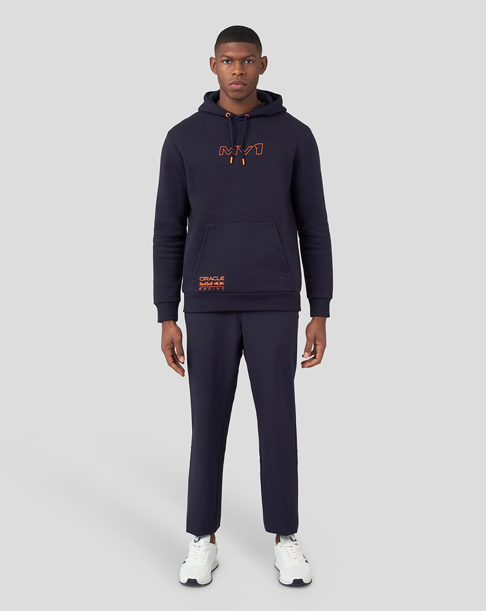 Full model wearing navy hoodie with orange chest logo and drawstring hood