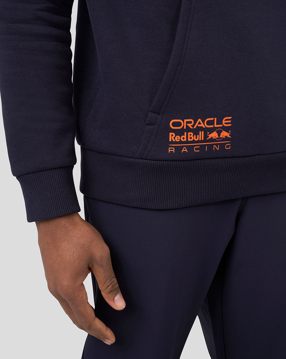 Close up of navy hoodie hem with bright orange Oracle Red Bull Racing logo