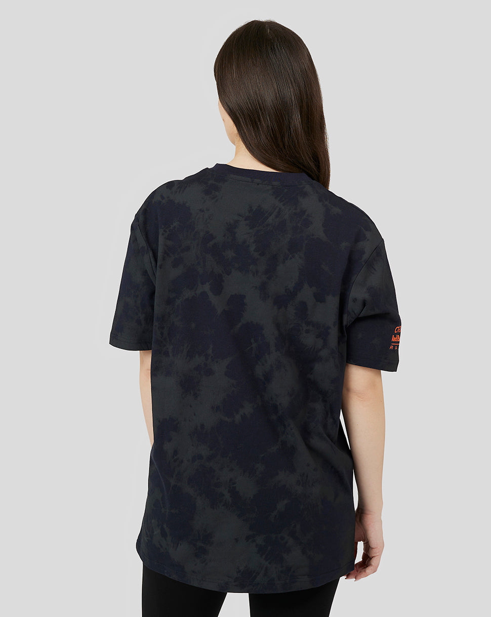 Rear angled view of a dark tie-dye Oracle Red Bull Racing T-shirt featuring orange sleeve branding