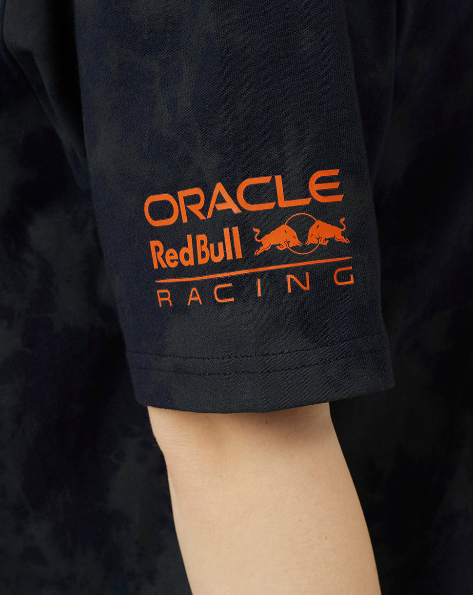 Close up of sleeve showing orange Oracle Red Bull Racing logo on dark navy T-shirt