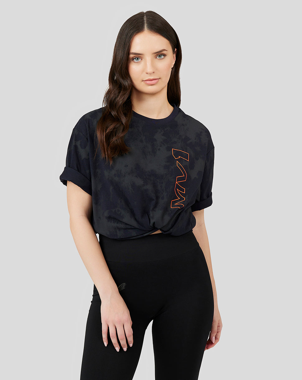 Model wearing a dark tie-dye Oracle Red Bull Racing T-shirt with orange VERSTAPPEN print down the front