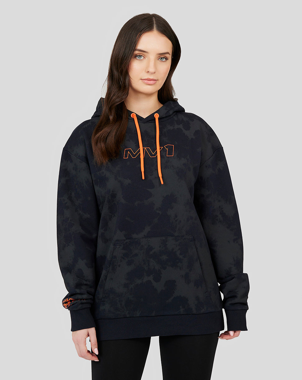 Woman wearing a dark tie dye Oracle Red Bull Racing hoodie with orange drawstrings and chest logo