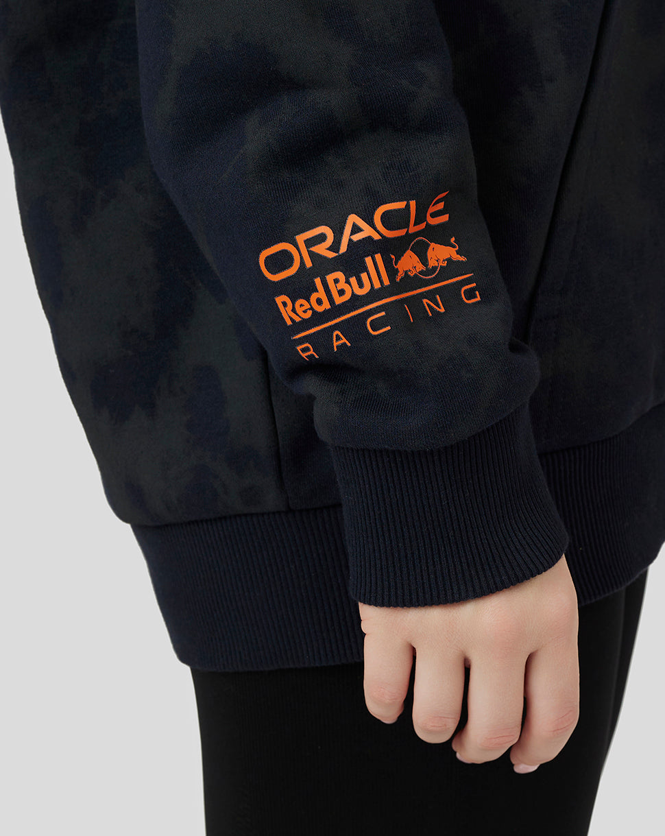 Close-up of hoodie sleeve showing orange Oracle Red Bull Racing logo tab on the hem.
