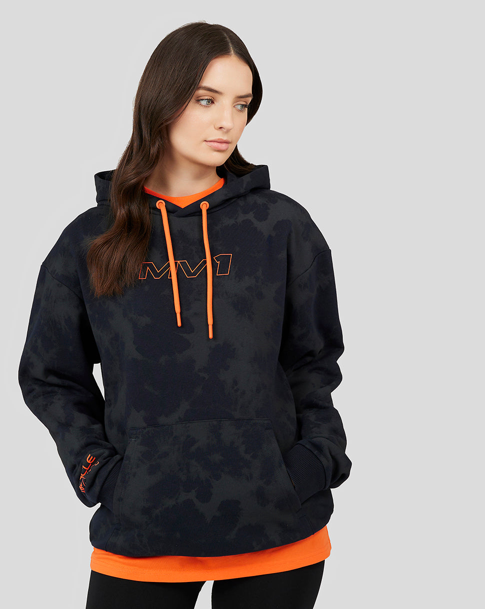 Female model wearing a dark tie-dye oversized Oracle Red Bull Racing Max Verstappen hoodie with orange drawstrings.