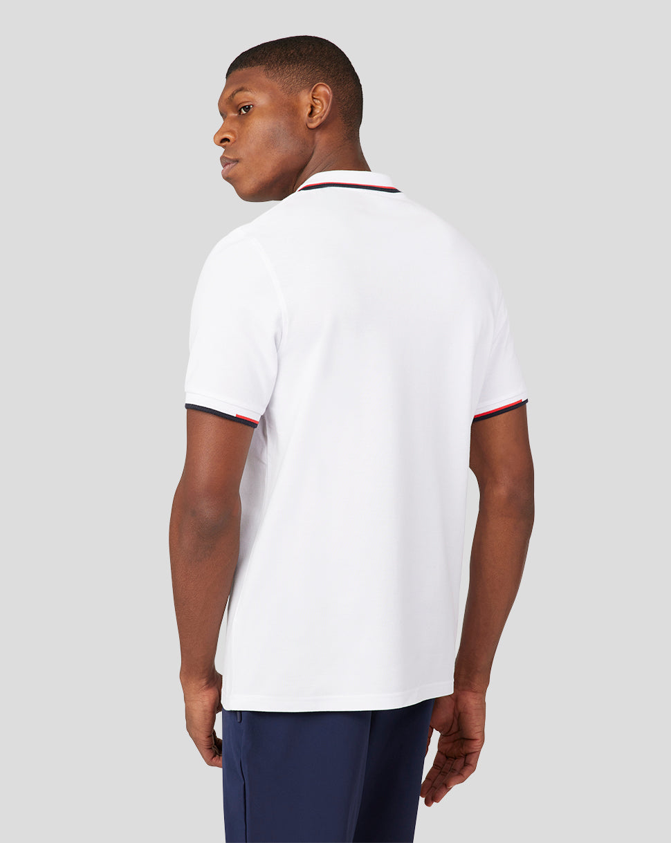 Back three-quarter view of white Oracle Red Bull Racing polo on a model with contrast tipped collar and sleeve trim