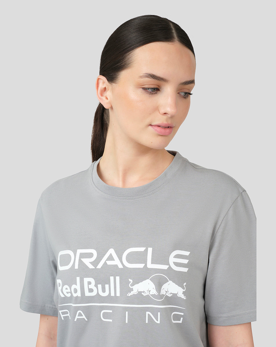 Close-up of a model wearing grey Oracle Red Bull Racing T shirt with a large front logo.