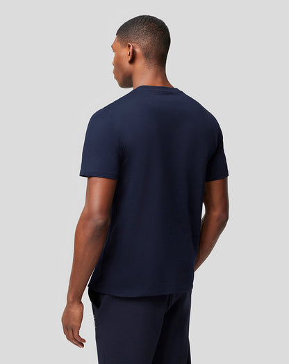 Back view of a model wearing a navy Oracle Red Bull Racing T shirt with no visible logo
