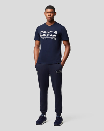 Full-body view of a model in Night Sky navy Oracle Red Bull Racing apparel with a logo T shirt and matching joggers