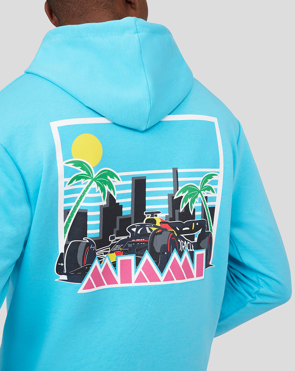 Back view of a man wearing River Blue hoodie with a large Miami graphic on the back.