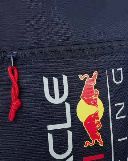 Close up of navy Night Sky backpack showing Red Bull logo on the front with a red cord zipper pull