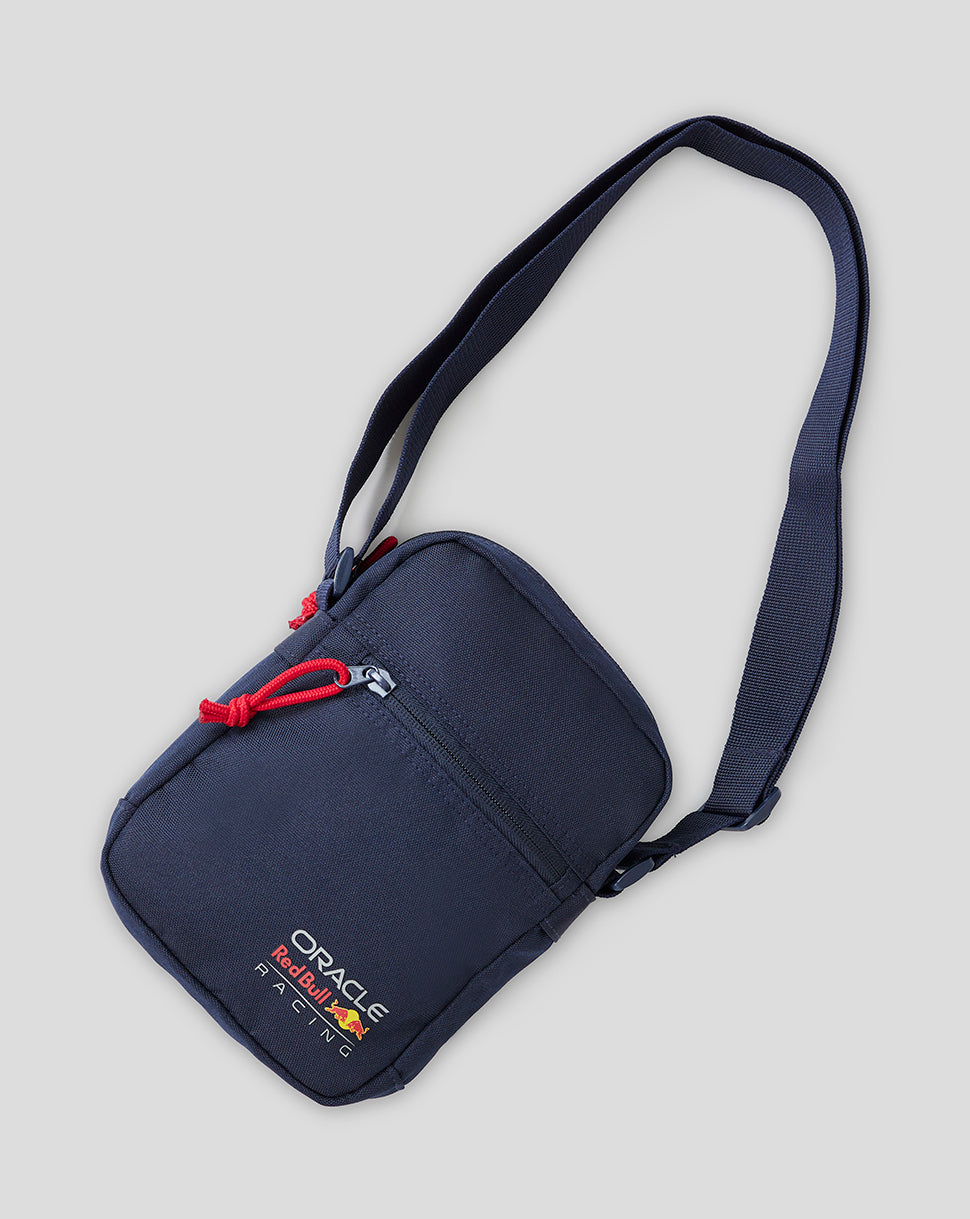 Navy crossbody bag with Red Bull Racing branding and an adjustable strap