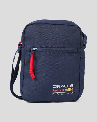 Navy crossbody bag with red zipper pull and Oracle Red Bull Racing branding